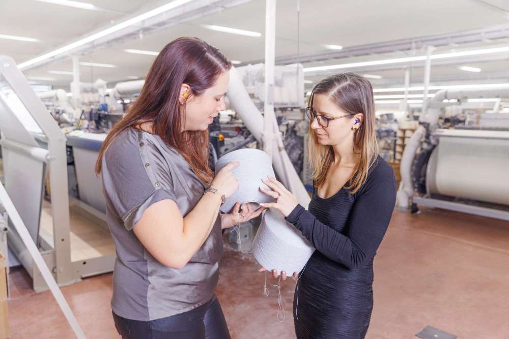 2 workers inspect the product